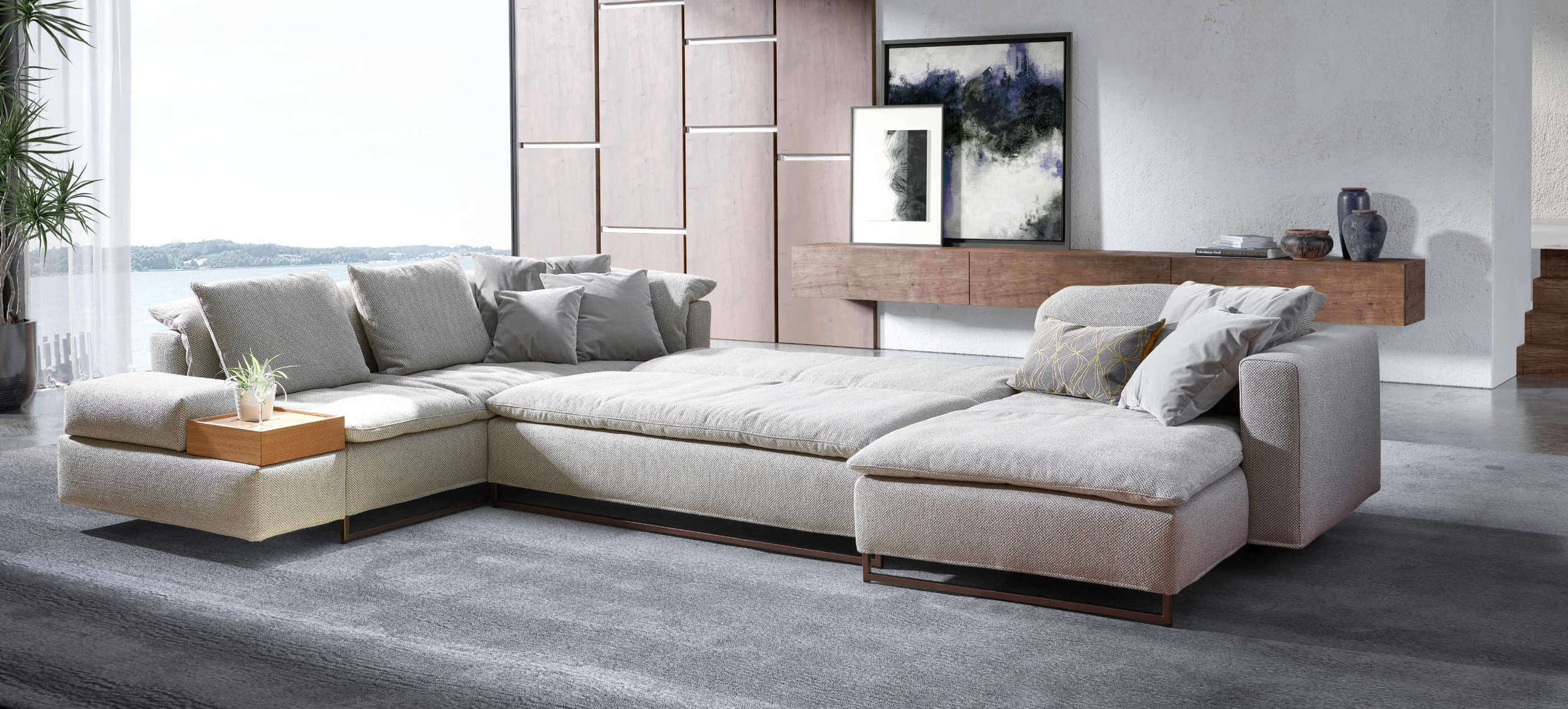 Isla Ecksofa von Signet, ausgeklappt als Schlafsofa mit großzügiger Liegefläche, abgebildet in einem modernen Wohnzimmer.